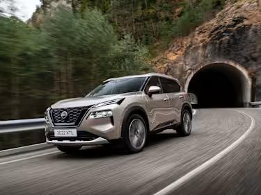 Nissan X-Trail car driving through a tunnel in the mountains