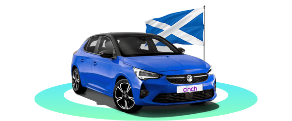 A blue Vauxhall car with a "cinch" license plate in front of a Scottish flag on a black background.