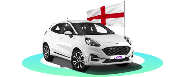 White Ford Puma with "cinch" plate, parked on a teal circle with England's flag waving behind.