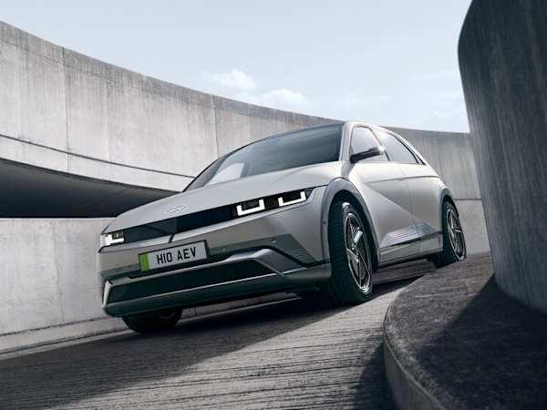 Hyundai IONIQ 5 car in silver driving down a car park spiral