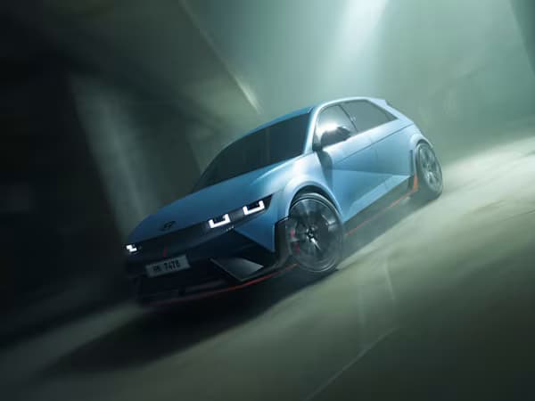 Hyundai IONIQ 5 car in blue driving through an underground car park